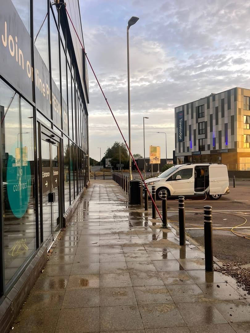 Professional window cleaner at work